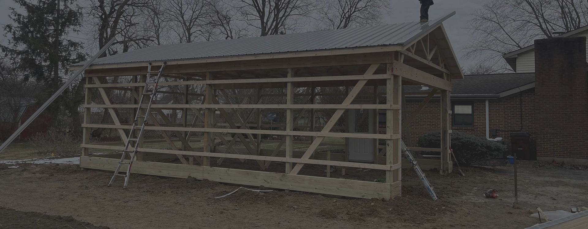 Photo of a garage being build by Revolution Barn and Garage Builders.